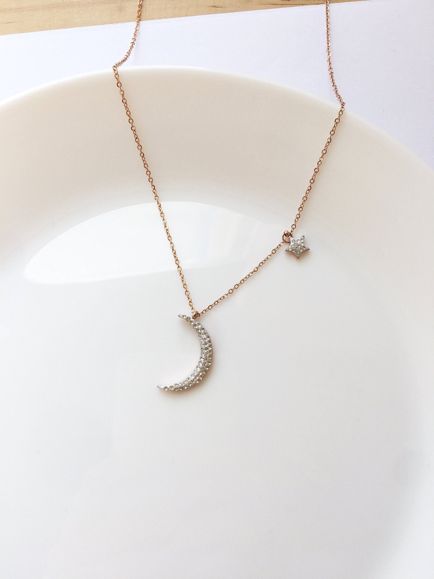 Shiny new moon shape rose gold tone stainless steel necklace